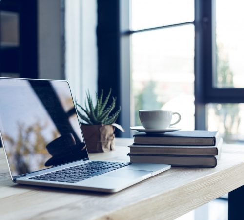 Design,Of,Workplace,With,Laptop,And,Cup,Of,Coffee,In